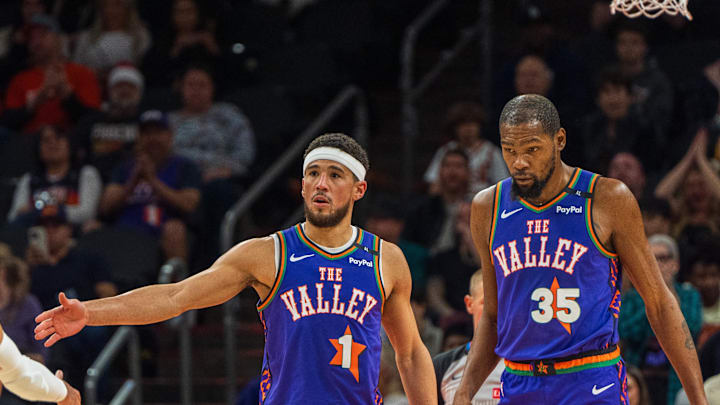 Dec 15, 2024; Phoenix, Arizona, USA; Phoenix Suns guard Devin Booker (1) and forward Kevin Durant (35) react after a time out in the second half during a game against the Portland Trail Blazers at Footprint Center. Mandatory Credit: Allan Henry-Imagn Images