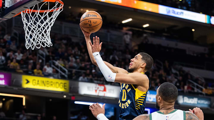 Jan 3, 2024; Indianapolis, Indiana, USA; Indiana Pacers guard Tyrese Haliburton (0) shoots the ball