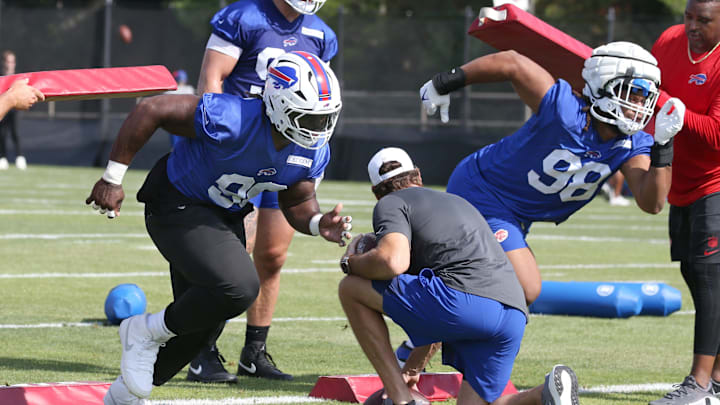 Bills defensive tackles Larry Ogunjobi and Deone Walker explode off the line during drills during the second day of Buffalo Bills training camp at St. John Fisher University Thursday, July 24, 2025 in Pittsford.