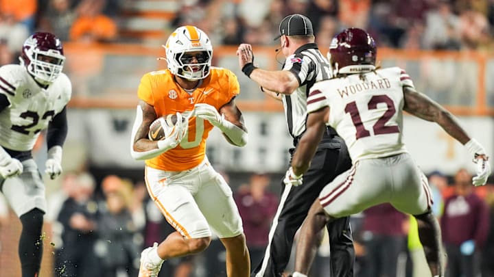 Tennessee tight end Ethan Davis (0) tries to move past a referee and Mississippi State safety Tyler Woodard (12) during a college football game between Tennessee and Mississippi State at Neyland Stadium in Knoxville, Tenn., on Saturday, Nov. 9, 2024.