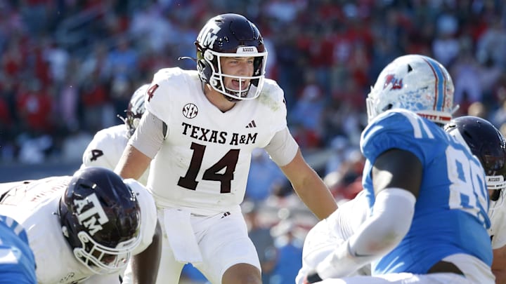 Nov 4, 2023; Oxford, Mississippi, USA; Texas A&M Aggies quarterback Max Johnson (14) gives direction prior to the snap during the second half against the Mississippi Rebels at Vaught-Hemingway Stadium. Mandatory Credit: Petre Thomas-Imagn Images