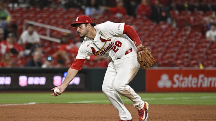 Sep 15, 2025; St. Louis, Missouri, USA; St. Louis Cardinals third baseman Nolan Arenado (28) fields a ground ball hit by Cincinnati Reds third baseman Santiago Espinal (not pictured) in the ninth inning at Busch Stadium. Mandatory Credit: Joe Puetz-Imagn Images Sep 15, 2025; St. Louis, Missouri, USA; St. Louis Cardinals third baseman Nolan Arenado (28) fields a ground ball hit by Cincinnati Reds third baseman Santiago Espinal (not pictured) in the ninth inning at Busch Stadium. Mandatory Credit: Joe Puetz-Imagn Images