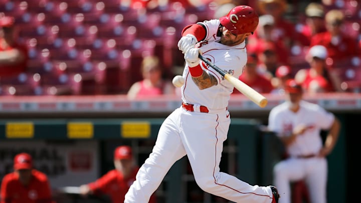 Cincinnati Reds catcher Tucker Barnhart (16) scores third baseman Eugenio Suarez (7) on an RBI single in the first inning of the MLB National League game between the Cincinnati Reds and the Pittsburgh Pirates at Great American Ball Park in downtown Cincinnati on Monday, Sept. 27, 2021. The Reds led 8-1 in the top of the sixth inning.

Pittsburgh Pirates At Cincinnati Reds