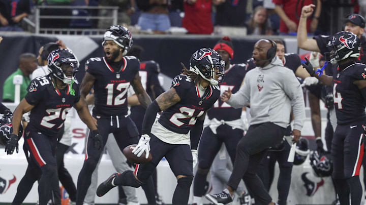 Dec 15, 2024; Houston, Texas, USA; Houston Texans cornerback Derek Stingley Jr. (24) runs with the ball after an interception during the fourth quarter against the Miami Dolphins at NRG Stadium. Mandatory Credit: Troy Taormina-Imagn Images