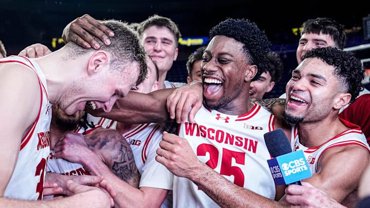 Wisconsin forward Aleksas Bieliauskas (32), left, and guard John Blackwell (25) celebrate 91-88 win over Michigan at Crisler Center in Ann Arbor on Saturday, Jan. 10, 2026.4