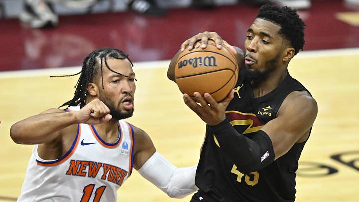 Oct 31, 2023; Cleveland, Ohio, USA; New York Knicks guard Jalen Brunson (11) defends Cleveland Cavaliers guard Donovan Mitchell (45) in the fourth quarter at Rocket Mortgage FieldHouse. Mandatory Credit: David Richard-Imagn Images