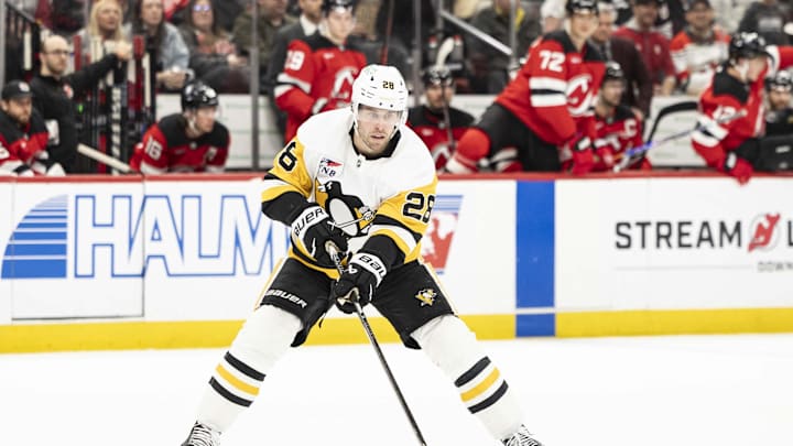 Apr 9, 2026; Newark, New Jersey, USA; Pittsburgh Penguins defenseman Parker Wotherspoon (28) skates with the puck against the New Jersey Devils during the second period at Prudential Center. Mandatory Credit: Luther Schlaifer-Imagn Images