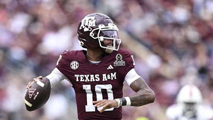 Dec 20, 2025; College Station, TX, USA; Texas A&M Aggies quarterback Marcel Reed (10) looks to pass the ball during the first half against the Miami Hurricanes at Kyle Field. Mandatory Credit: Maria Lysaker-Imagn Images