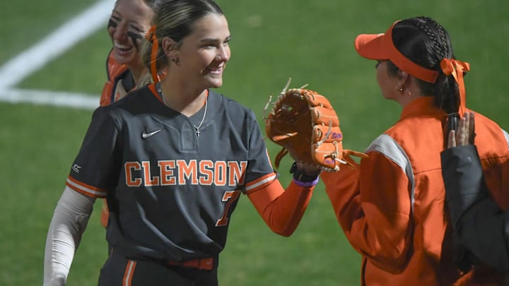 Clemson senior Reese Basinger (7) greets catcher Aby Vieira (4) after getting out of the during the top of the fourth inning at McWhorter Stadium in Clemson Tuesday, February 18, 2025. Clemson senior Reese Basinger (7) greets catcher Aby Vieira (4) after getting out of the during the top of the fourth inning at McWhorter Stadium in Clemson Tuesday, February 18, 2025.
