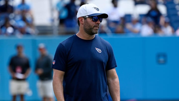 Tennessee Titans head coach Brian Callahan watches his players warm up during “Back Together Weekend” training camp practice at Nissan Stadium Saturday, July 26, 2025, in Nashville, Tenn. Tennessee Titans head coach Brian Callahan watches his players warm up during “Back Together Weekend” training camp practice at Nissan Stadium Saturday, July 26, 2025, in Nashville, Tenn.