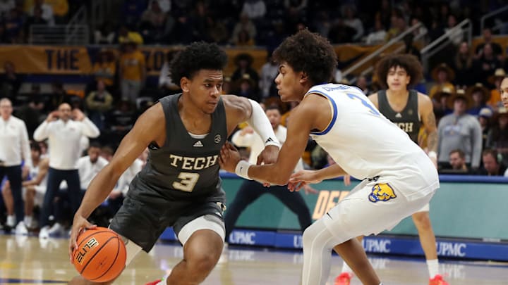 Feb 25, 2025; Pittsburgh, Pennsylvania, USA;  Georgia Tech Yellow Jackets guard Jaeden Mustaf (3) dribbles against Pittsburgh Panthers guard Brandin Cummings (right) during the second half at the Petersen Events Center. Mandatory Credit: Charles LeClaire-Imagn Images