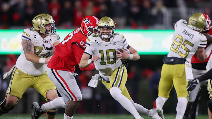 Nov 29, 2024; Athens, Georgia, USA; Georgia Tech Yellow Jackets quarterback Haynes King (10) runs the ball against the Georgia Bulldogs in the second quarter at Sanford Stadium. Mandatory Credit: Brett Davis-Imagn Images