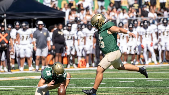 Paramus Catholic football at St. Joseph Regional, Saturday, Sept. 21, 2024, Montvale, New Jersey. Saint Joseph's #13 Michael Cevetillo holds the ball for kicker #45 Salvatore Salafia.