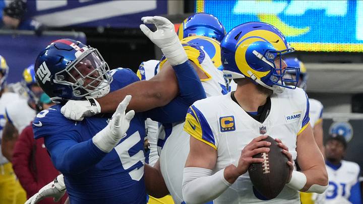 East Rutherford, NJ December 31, 2023 -- Kayvon Thibodeaux of the Giants pressures Rams quarterback Matthew Stafford in the second half. The Los Angeles Rams edged the New York Giants 26-25 on December 31, 2023 at MetLife Stadium in East Rutherford, NJ. East Rutherford, NJ December 31, 2023 -- Kayvon Thibodeaux of the Giants pressures Rams quarterback Matthew Stafford in the second half. The Los Angeles Rams edged the New York Giants 26-25 on December 31, 2023 at MetLife Stadium in East Rutherford, NJ.