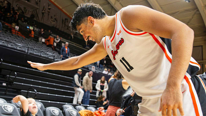 Oregon State's Parsa Fallah (11) high-fives a young fan after defeating San Diego at Gill Coliseum on Saturday, Jan. 4, 2025, in Corvallis, Ore. Oregon State's Parsa Fallah (11) high-fives a young fan after defeating San Diego at Gill Coliseum on Saturday, Jan. 4, 2025, in Corvallis, Ore.