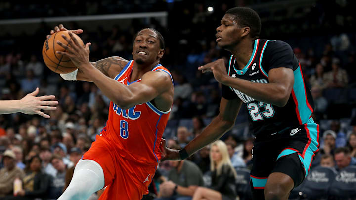 Jan 9, 2026; Memphis, Tennessee, USA; Oklahoma City Thunder guard Jalen Williams (8) drives to the basket as Memphis Grizzlies forward Cedric Coward (23) defends during the first quarter at FedExForum. Mandatory Credit: Petre Thomas-Imagn Images