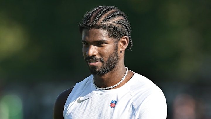 Jul 23, 2025; Berea, OH, USA; Cleveland Browns quarterback Shedeur Sanders (12) walks off the field during training camp at CrossCountry Mortgage Campus. Mandatory Credit: Ken Blaze-Imagn Images