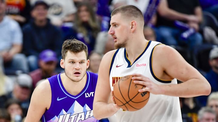 Nov 27, 2024; Salt Lake City, Utah, USA; Utah Jazz center Walker Kessler (24) defends Denver Nuggets center Nikola Jokic (15) during the second half at the Delta Center. Mandatory Credit: Christopher Creveling-Imagn Images