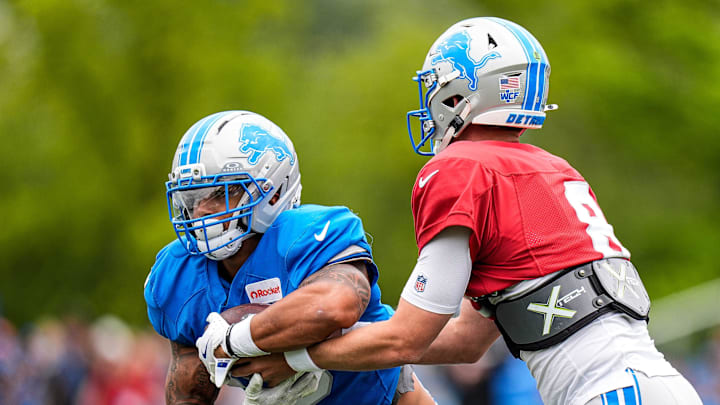 Detroit Lions running back Craig Reynolds (13) practices with quarterback Kyle Allen (8) during training camp. Detroit Lions running back Craig Reynolds (13) practices with quarterback Kyle Allen (8) during training camp.