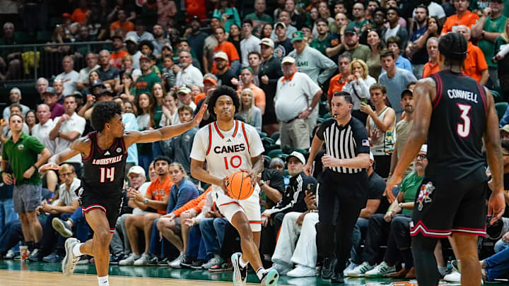 Mar 7, 2026; Coral Gables, Florida, USA; Miami Hurricanes guard Tru Washington (10) attempts a three-point basket to tie the game against the Louisville Cardinals during the second half at Watsco Center. Mandatory Credit: Jeff Romance-Imagn Images