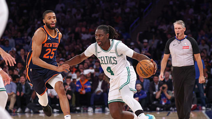 May 12, 2025; New York, New York, USA; Boston Celtics guard Jrue Holiday (4) dribbles in front of New York Knicks forward Mikal Bridges (25) in the second half during game four of the second round for the 2025 NBA Playoffs at Madison Square Garden. Mandatory Credit: Vincent Carchietta-Imagn Images