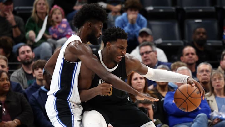 Memphis Grizzlies forward-center Jaren Jackson Jr. (13) moves to the basket as Orlando Magic forward Jonathan Isaac (1) defends during the first half at FedExForum.