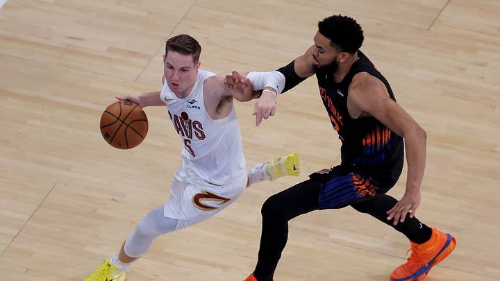 May 21, 2026; New York, New York, USA; Cleveland Cavaliers guard Sam Merrill (5) controls the ball against New York Knicks center Karl-Anthony Towns (32) during the second quarter of game two of the eastern conference finals during the 2026 NBA playoffs at Madison Square Garden. Mandatory Credit: Brad Penner-Imagn Images