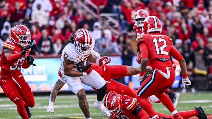 Nov 1, 2025; College Park, Maryland, USA; Indiana Hoosiers tight end Riley Nowakowski (37) rushes through Maryland Terrapins defensive lineman Nahsir Taylor (40) tackle attempt during the second quarter at SECU Stadium. Mandatory Credit: Tommy Gilligan-Imagn Images Nov 1, 2025; College Park, Maryland, USA; Indiana Hoosiers tight end Riley Nowakowski (37) rushes through Maryland Terrapins defensive lineman Nahsir Taylor (40) tackle attempt during the second quarter at SECU Stadium. Mandatory Credit: Tommy Gilligan-Imagn Images