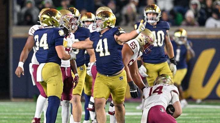 Nov 9, 2024; South Bend, Indiana, USA; Notre Dame Fighting Irish defensive lineman Donovan Hinish (41) reacts after sacking Florida State Seminoles quarterback Luke Kromenhoek (14) in the third quarter at Notre Dame Stadium. Nov 9, 2024; South Bend, Indiana, USA; Notre Dame Fighting Irish defensive lineman Donovan Hinish (41) reacts after sacking Florida State Seminoles quarterback Luke Kromenhoek (14) in the third quarter at Notre Dame Stadium.