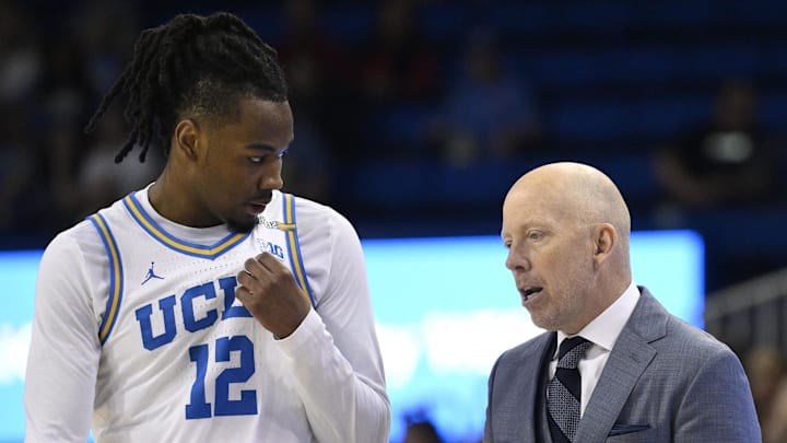 Feb 23, 2025; Los Angeles, California, USA; UCLA Bruins head coach Mick Cronin talks to UCLA Bruins guard Sebastian Mack (12) during the second half at Pauley Pavilion presented by Wescom. Mandatory Credit: Robert Hanashiro-Imagn Images