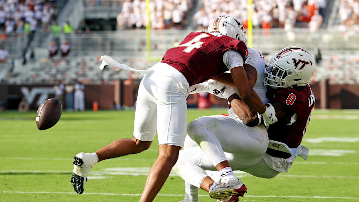 Sep 21, 2024; Blacksburg, Virginia, USA; Virginia Tech Hokies linebacker Keli Lawson (0) forces Rutgers Scarlet Knights tight end Kenny Fletcher (12) to fumbles near the goal line during the second quarter at Lane Stadium. Mandatory Credit: Peter Casey-Imagn Images Sep 21, 2024; Blacksburg, Virginia, USA; Virginia Tech Hokies linebacker Keli Lawson (0) forces Rutgers Scarlet Knights tight end Kenny Fletcher (12) to fumbles near the goal line during the second quarter at Lane Stadium. Mandatory Credit: Peter Casey-Imagn Images