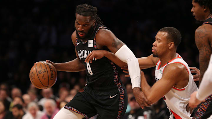 Feb 21, 2019; Brooklyn, NY, USA; Brooklyn Nets small forward DeMarre Carroll (9) drives around Portland Trail Blazers shooting guard Rodney Hood (5) during the second quarter at Barclays Center. Mandatory Credit: Brad Penner-Imagn Images