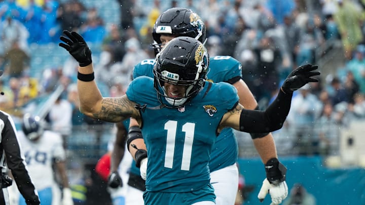 Dec 29, 2024; Jacksonville, Florida, USA; Jacksonville Jaguars wide receiver Parker Washington (11) celebrates his touchdown against the Tennessee Titans in the second quarter at EverBank Stadium. Mandatory Credit: Jeremy Reper-Imagn Images Dec 29, 2024; Jacksonville, Florida, USA; Jacksonville Jaguars wide receiver Parker Washington (11) celebrates his touchdown against the Tennessee Titans in the second quarter at EverBank Stadium. Mandatory Credit: Jeremy Reper-Imagn Images