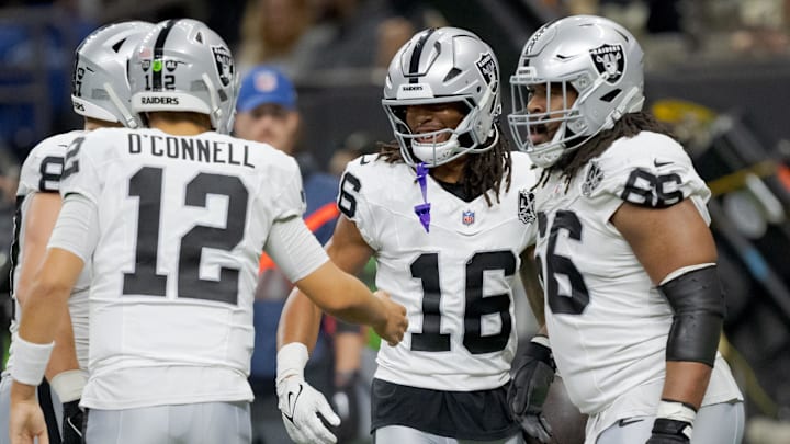 Dec 29, 2024; New Orleans, Louisiana, USA; Las Vegas Raiders wide receiver Jakobi Meyers (16) celebrates a touchdown reception throw by Las Vegas Raiders quarterback Aidan O'Connell (12) during the second quarter against the New Orleans Saints at Caesars Superdome. Mandatory Credit: Matthew Hinton-Imagn Images