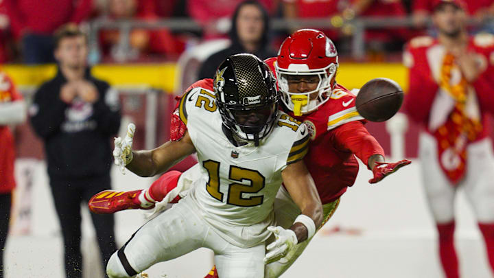 Oct 7, 2024; Kansas City, Missouri, USA; Kansas City Chiefs safety Bryan Cook (6) breaks up a pass intended for New Orleans Saints wide receiver Chris Olave (12) during the second half at GEHA Field at Arrowhead Stadium. Mandatory Credit: Jay Biggerstaff-Imagn Images