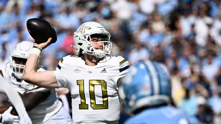 Oct 12, 2024; Chapel Hill, North Carolina, USA; Georgia Tech Yellow Jackets quarterback Haynes King (10) looks to pass as North Carolina Tar Heels defensive back Antavious Lane (1) pressures in the first quarter at Kenan Memorial Stadium. Mandatory Credit: Bob Donnan-Imagn Images Oct 12, 2024; Chapel Hill, North Carolina, USA; Georgia Tech Yellow Jackets quarterback Haynes King (10) looks to pass as North Carolina Tar Heels defensive back Antavious Lane (1) pressures in the first quarter at Kenan Memorial Stadium. Mandatory Credit: Bob Donnan-Imagn Images