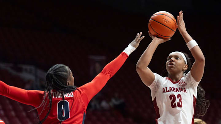 Feb 5, 2026; Tuscaloosa, AL, USA; Ole Miss guard Sira Thienou (0) defends a shot by Alabama guard Jessica Timmons (23) at Coleman Coliseum. Mandatory Credit: Gary Cosby Jr.-Tuscaloosa News