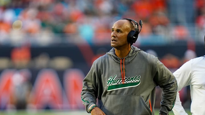 Nov 8, 2025; Miami Gardens, Florida, USA; Miami Hurricanes defensive line coach Jason Taylor looks on during a timeout in a game against the Syracuse Orange during the second quarter at Hard Rock Stadium. Mandatory Credit: Jeff Romance-Imagn Images Nov 8, 2025; Miami Gardens, Florida, USA; Miami Hurricanes defensive line coach Jason Taylor looks on during a timeout in a game against the Syracuse Orange during the second quarter at Hard Rock Stadium. Mandatory Credit: Jeff Romance-Imagn Images