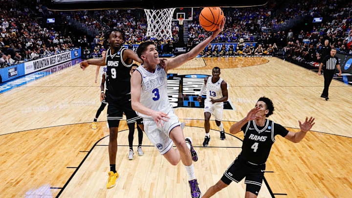 Mar 20, 2025; Denver, CO, USA; Brigham Young Cougars guard Egor Demin (3) drives to the net against VCU Rams forward Luke Bamgboye (9) as forward Jack Clark (4) defends in the second half at Ball Arena. Mandatory Credit: Isaiah J. Downing-Imagn Images