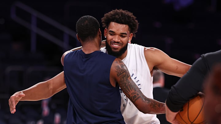Oct 13, 2024; New York, New York, USA; Minnesota Timberwolves forward Jaden McDaniels (3), left, embraces New York Knicks center Karl-Anthony Towns (32), right, before the game at Madison Square Garden. Mandatory Credit: Vincent Carchietta-Imagn Images
