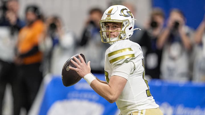 Nov 28, 2025; Atlanta, Georgia, USA; Georgia Tech Yellow Jackets quarterback Haynes King (10) looks to pass out of his own end zone against the Georgia Bulldogs during the first quarter at Mercedes-Benz Stadium. Mandatory Credit: Dale Zanine-Imagn Images