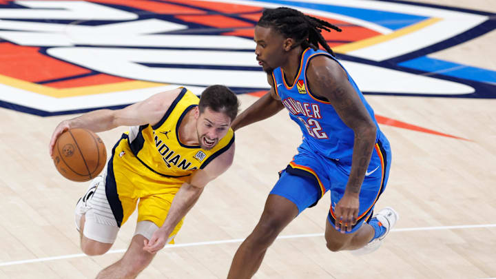 Jun 22, 2025; Oklahoma City, Oklahoma, USA; Indiana Pacers guard T.J. McConnell (9) dribbles against Oklahoma City Thunder guard Cason Wallace (22) during the second half of game seven of the 2025 NBA Finals at Paycom Center. Mandatory Credit: Alonzo Adams-Imagn Images