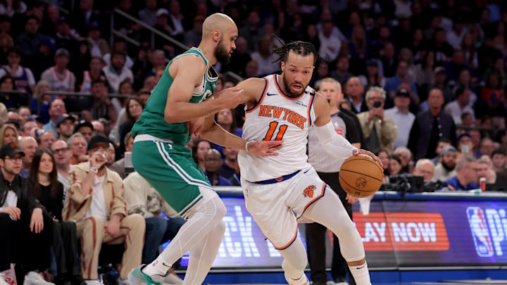 New York Knicks guard Jalen Brunson drives to the basket against Boston Celtics guard Derrick White.