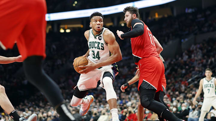 Feb 5, 2022; Portland, Oregon, USA; Milwaukee Bucks power forward Giannis Antetokounmpo (34) drives to the basket against Portland Trail Blazers Center Jusuf Nurkic (27) during the first half at Moda Center. Mandatory Credit: Soobum Im-Imagn Images