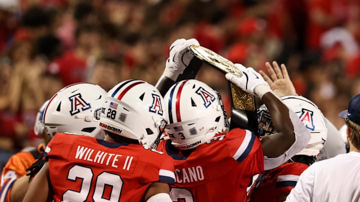 Sep 7, 2024; Tucson, Arizona, USA; Arizona Wildcats running back Kedrick Reescano (3) holds up a belt and celebrates a touchdown with teammates against Northern Arizona Lumberjacks during the fourth quarter at Arizona Stadium. Mandatory Credit: Aryanna Frank-Imagn Images