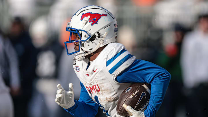 Dec 21, 2024; University Park, Pennsylvania, USA; Southern Methodist Mustangs running back Brashard Smith (1) carries the ball during the second half against the Penn State Nittany Lions at Beaver Stadium. Mandatory Credit: Vincent Carchietta-Imagn Images
