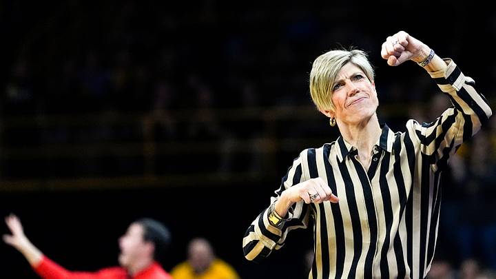 Iowa head coach Jan Jensen fist-pumps toward the end of a basketball game against the Ohio State Buckeyes Jan. 25, 2026 at Carver-Hawkeye Arena in Iowa City, Iowa.
