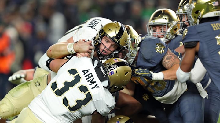 Nov 23, 2024; New York, New York, USA; Army Black Knights quarterback Bryson Daily (13) crosses the line for his second touchdown against the Notre Dame Fighting Irish during the second half at Yankee Stadium. Mandatory Credit: Danny Wild-Imagn Images Nov 23, 2024; New York, New York, USA; Army Black Knights quarterback Bryson Daily (13) crosses the line for his second touchdown against the Notre Dame Fighting Irish during the second half at Yankee Stadium. Mandatory Credit: Danny Wild-Imagn Images