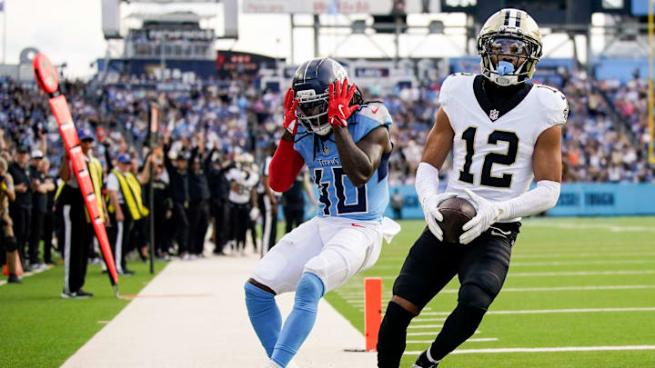 Tennessee Titans cornerback Kemon Hall (40) reacts as New Orleans Saints wide receiver Chris Olave (12) brings in a touchdown during the third quarter at Nissan Stadium in Nashville, Tenn., Sunday, Dec. 28, 2025.