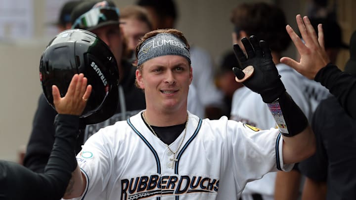 Akron RubberDucks catcher Cooper Ingle (2) celebrates in the dugout after hitting a solo home run against the Altoona Curve on May 20, 2025, in Akron, Ohio.